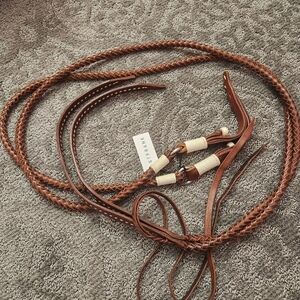S.FRANK braided leather horse reins with white stitching and accents.